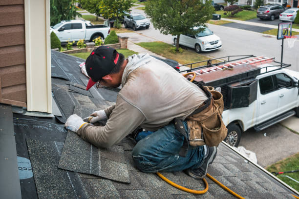 Professional Gutter Repair And Installation technician working in Houghton Lake, MI